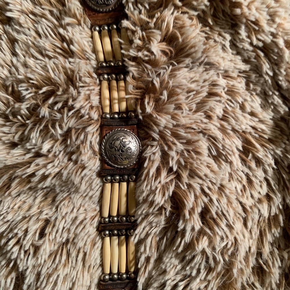 Faux bone belt with conchoes.